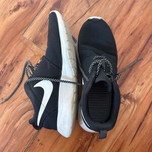 Well worn women’s Nike running shoe
